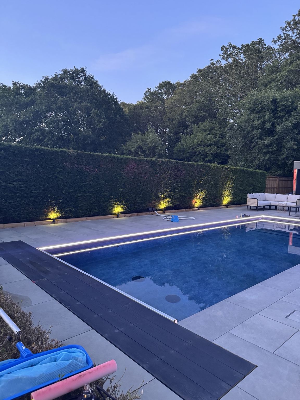 Poolside paving and seating in the evening